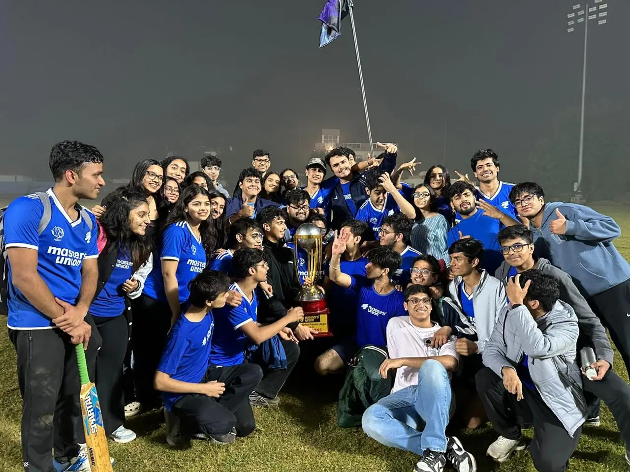 A sports team celebrating together