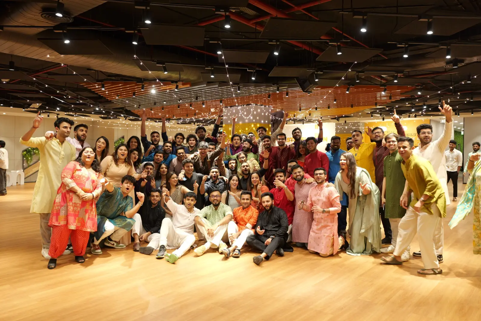 A large group in festive dress posing together