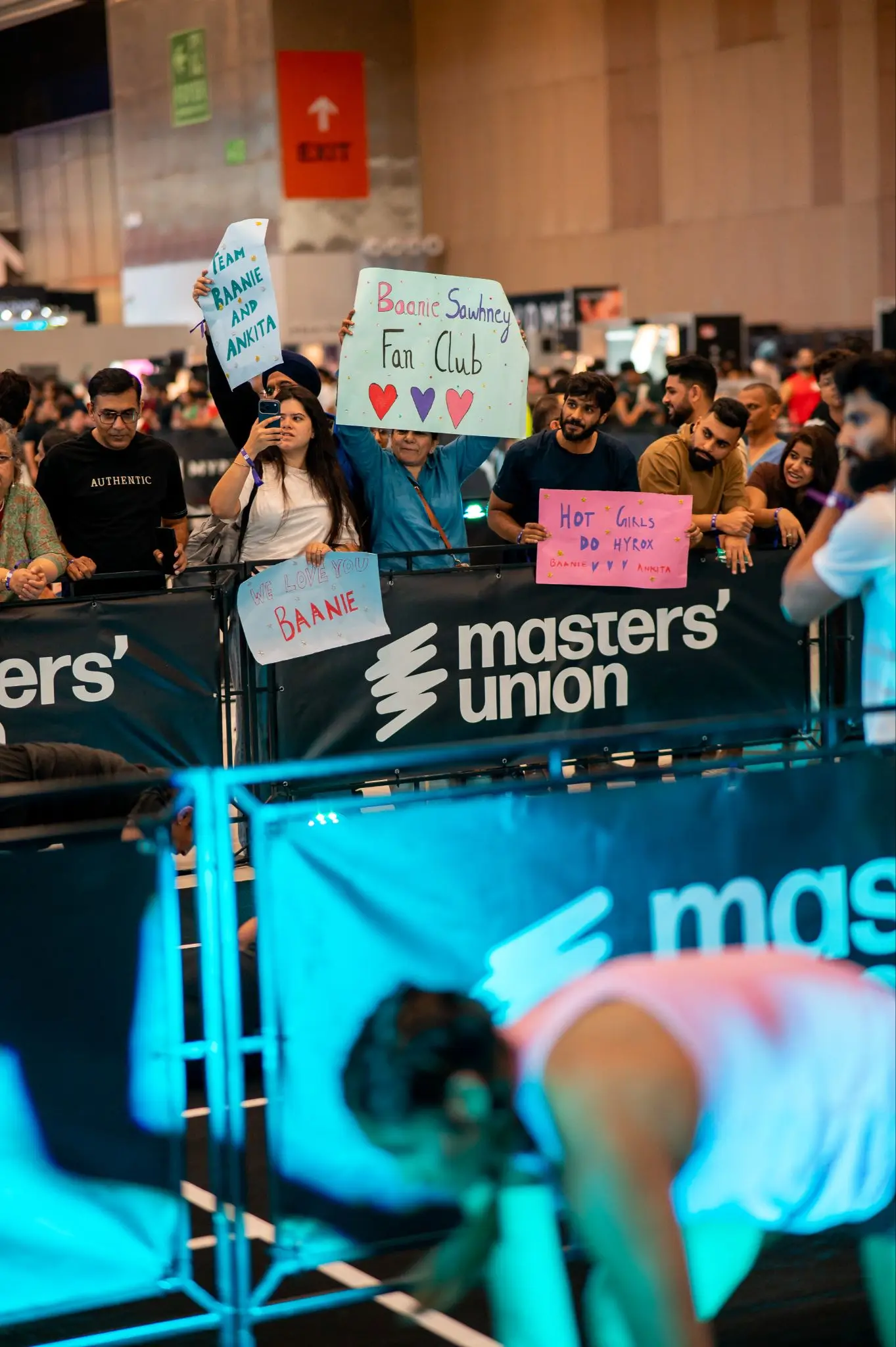 A Masters' Union fan club cheering with placards